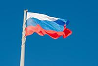 Russian state flag waving in the wind against the 