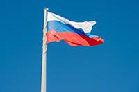 Russian state flag waving in the wind against the 