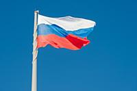 Russian state flag waving in the wind against the 