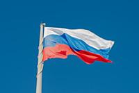 Russian state flag waving in the wind against the 