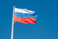 Russian state flag waving in the wind against the 