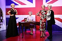 Dame Helen Mirren views three of her wax works at 