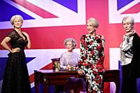 Dame Helen Mirren views three of her wax works at 