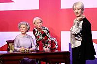 Dame Helen Mirren views three of her wax works at 