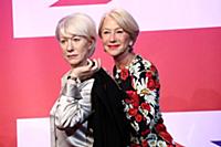 Dame Helen Mirren views three of her wax works at 