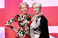 Dame Helen Mirren views three of her wax works at 