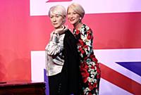 Dame Helen Mirren views three of her wax works at 