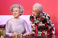 Dame Helen Mirren views three of her wax works at 