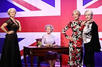 Dame Helen Mirren views three of her wax works at 