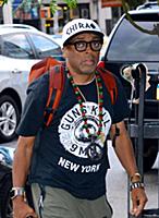Spike Lee arrives at a downtown hotel wearing a ts