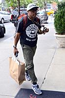 Spike Lee arrives at a downtown hotel wearing a ts
