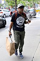 Spike Lee arrives at a downtown hotel wearing a ts