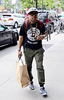 Spike Lee arrives at a downtown hotel wearing a ts