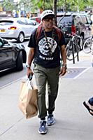 Spike Lee arrives at a downtown hotel wearing a ts