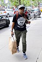 Spike Lee arrives at a downtown hotel wearing a ts