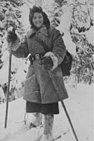 Medical nurse Liza Kozyukova advancing on skis in 