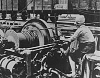 A Soviet woman works machinery to send allied supp