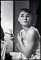 Audrey Hepburn makes up for a performance of Gigi 