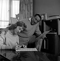 Ray Ellington, 1915-1985, at home in London with w
