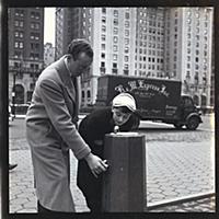 Audrey Hepburn using a public drinking fountain on