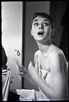 Audrey Hepburn makes up for a performance of Gigi 