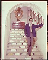 Dirk Bogarde, the film star and writer, at home at