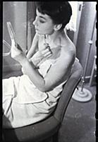 Audrey Hepburn makes up for a performance of Gigi 