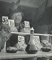 An old lady selling seafood on the beach at Southe