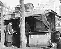 John Barclay, the owner of this tea stall, is givi
