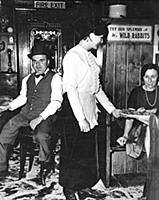 A waitress serves a booth at Flanagan's restaurant