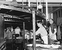 Deep below the kitchens the endless conveyors brin