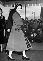 The Queen smiles as she arrives at Olympia, London