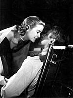 Grace Kelly and James Stewart got thirty seven kis