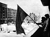 The red flag flies again from the balcony of a bui