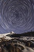 Stars rotating around Polaris, the North Star, ove
