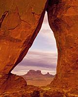 Buttes and mesas seen through arch, Teardrop Arch,