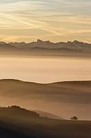 Hills in evening mist looking toward Swiss Alps,  