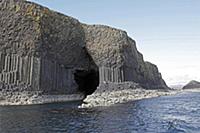 Sea cave with columnar basalt rock formations surm
