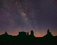 Milky Way and starry sky over buttes, Monument Val