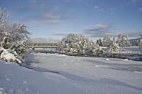 View of snow on ice covered river, with European O