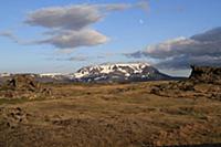 View of distant mountain in evening sunlight, with