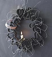 Advent wreath made from pastry cutters and a singl