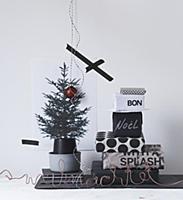 Stack of gifts wrapped in black and white paper ne