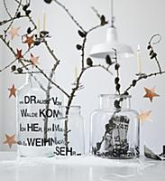 Larch branches with cones and stars arranged in th