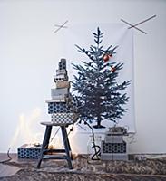 Stacked gifts wrapped in black and white paper bel
