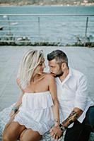 Romantic mid adult couple gazing at each other on 