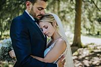 Romantic bride and groom hugging each other in woo