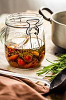 Confit tomatoes in a glass jar