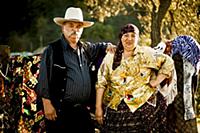 Romania / Negreni / 2014 / Gipsy man and his wife.