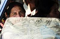 Romania / Negreni / 2014 / Old gipsy lady in a tra